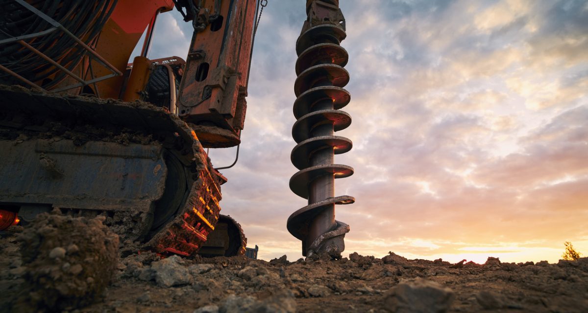 Building activity on contruction site. Close-up view of drilling machine.